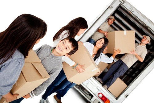 Removal team preparing a safe moving operation with protective packing materials