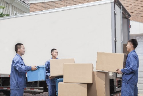 Furniture removals team loading household items in Dulwich
