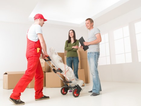 Packed moving boxes and furniture ready for transport