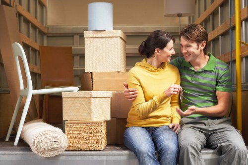 Professional removals van loading household items near Dulwich